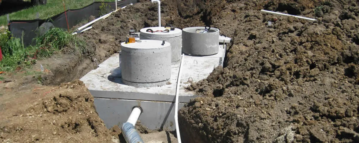Septic system repair and installation site with tank access ports in Fresno, CA